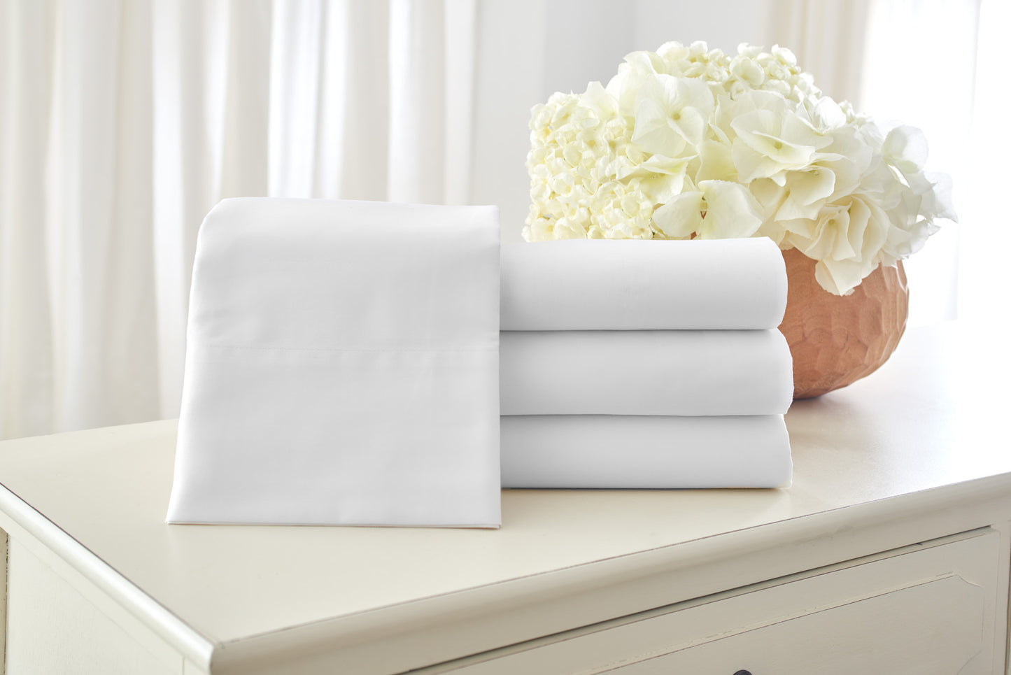 stack of white cotton sheets