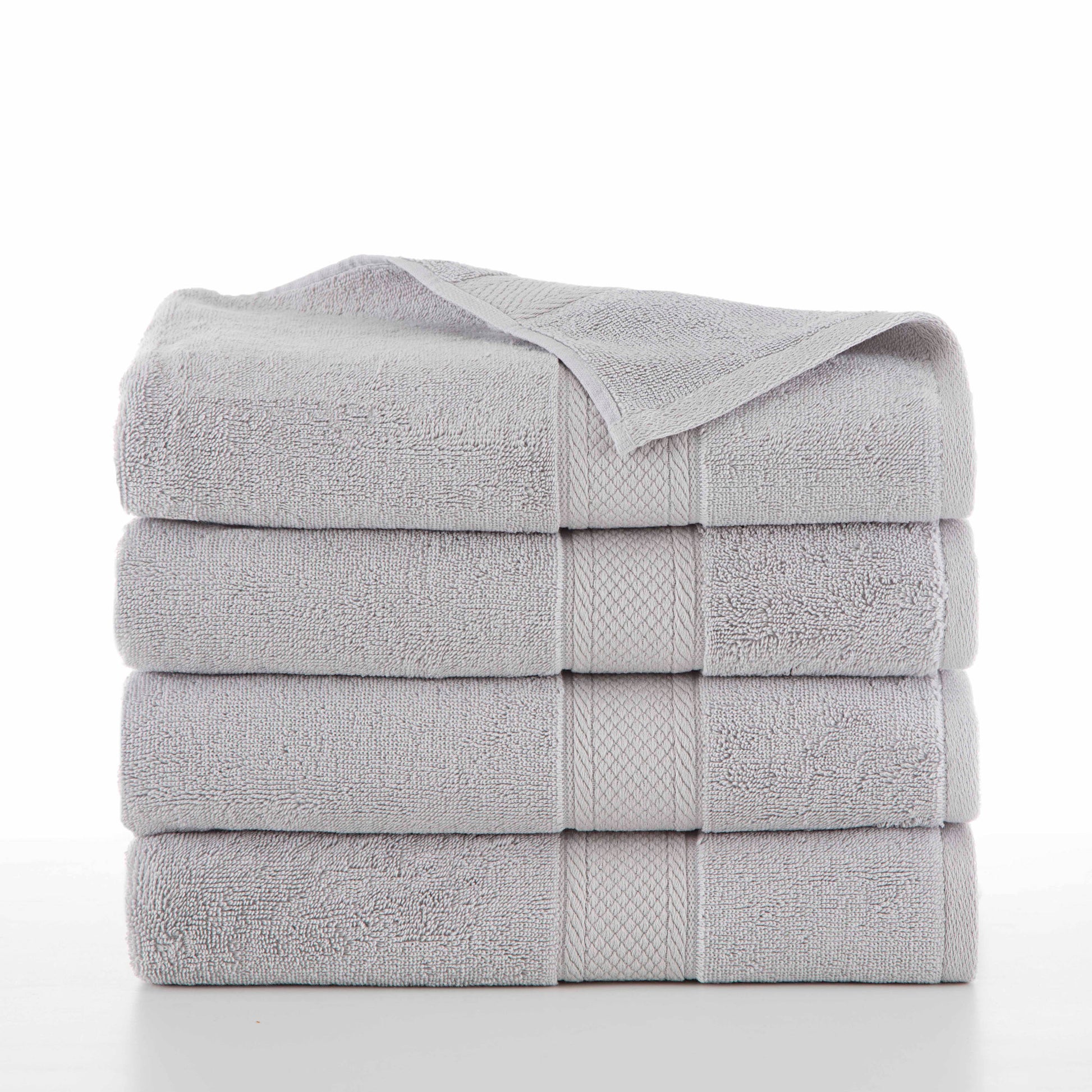 four grey towels folded in a stack