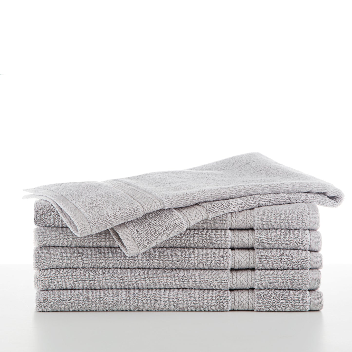 six grey towels in a stack