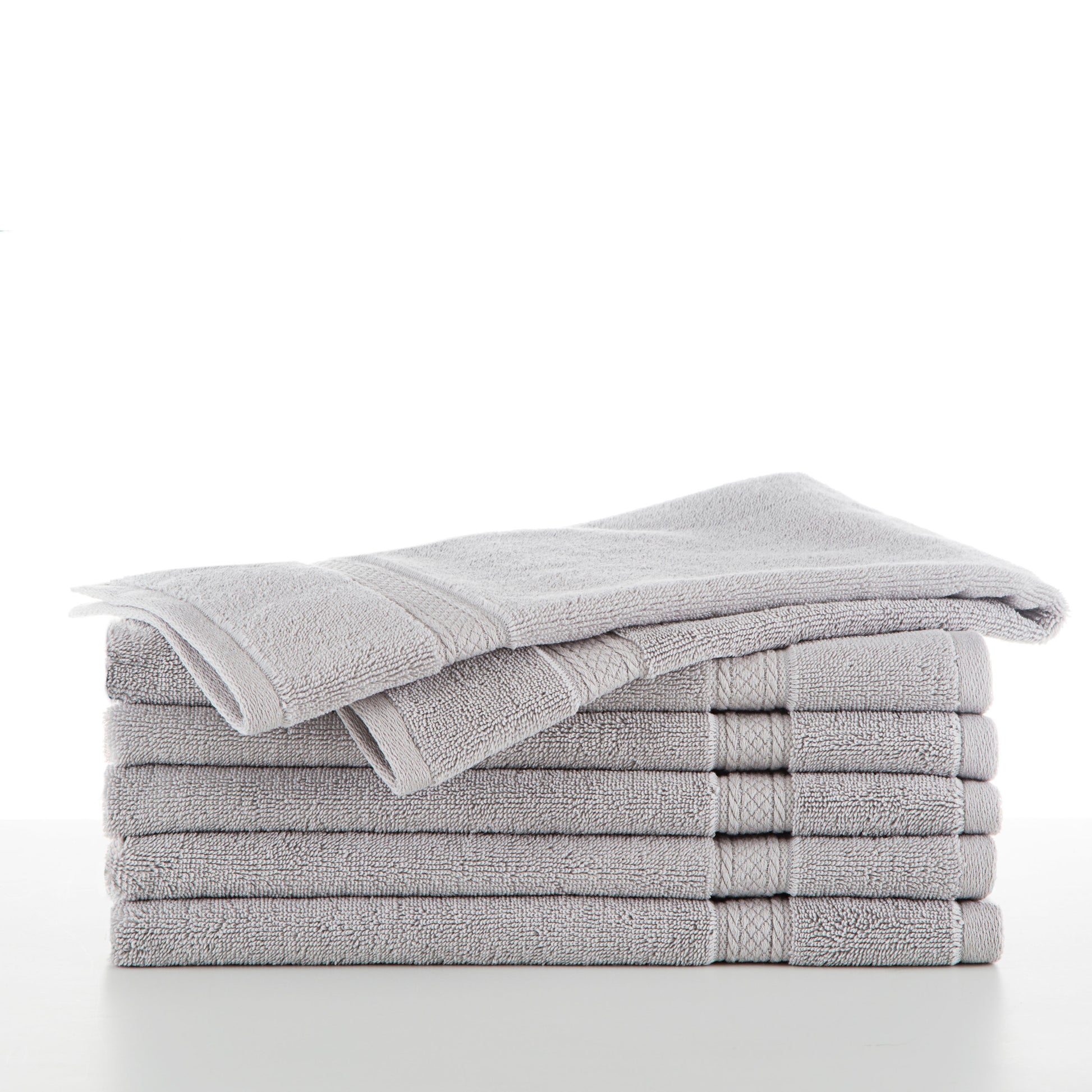 six grey towels in a stack