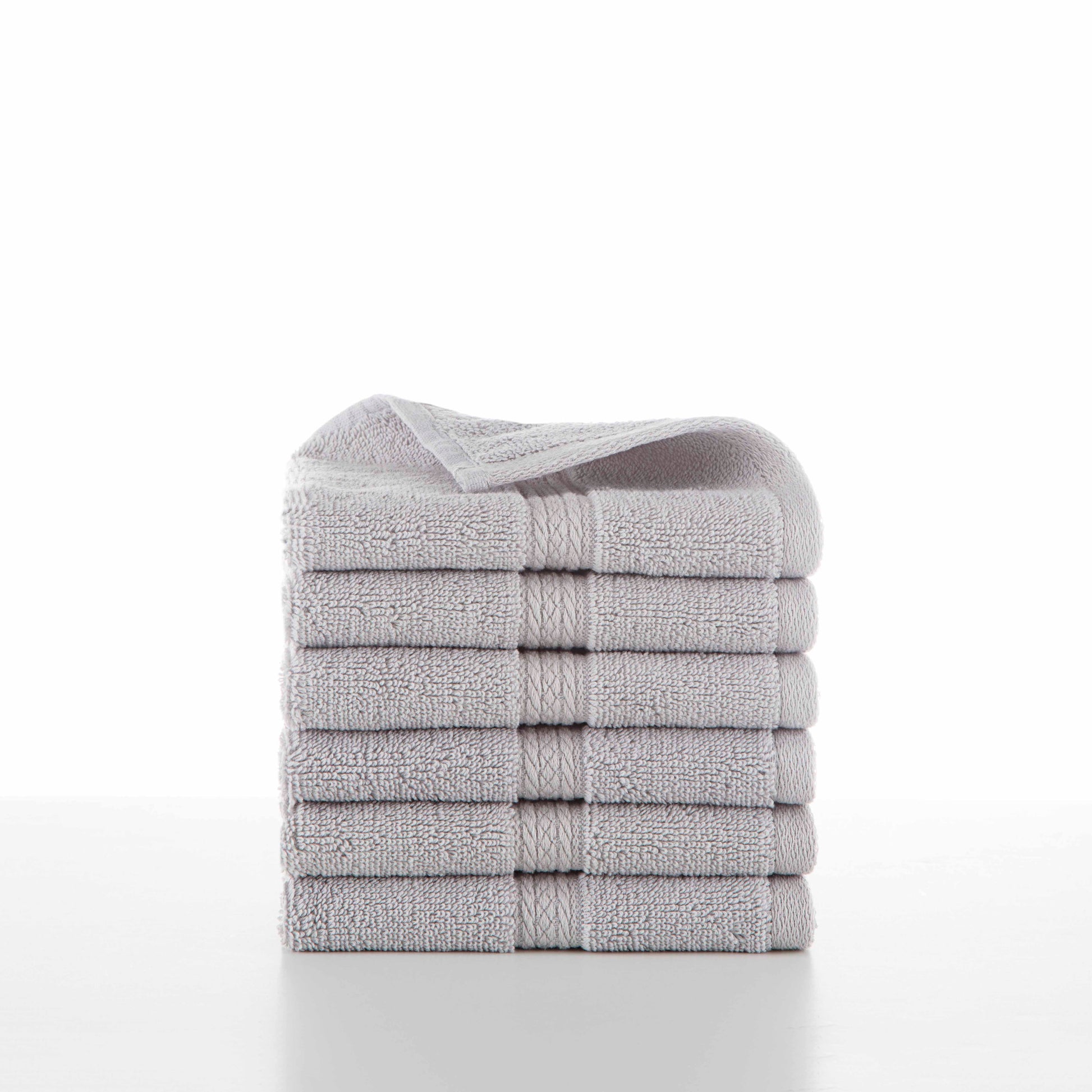 six grey towels in a stack