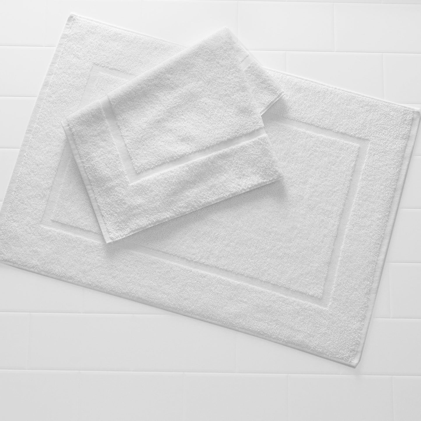 two white bath mats