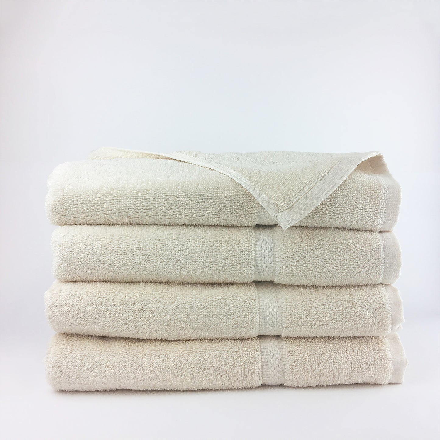four ecru towels in a stack
