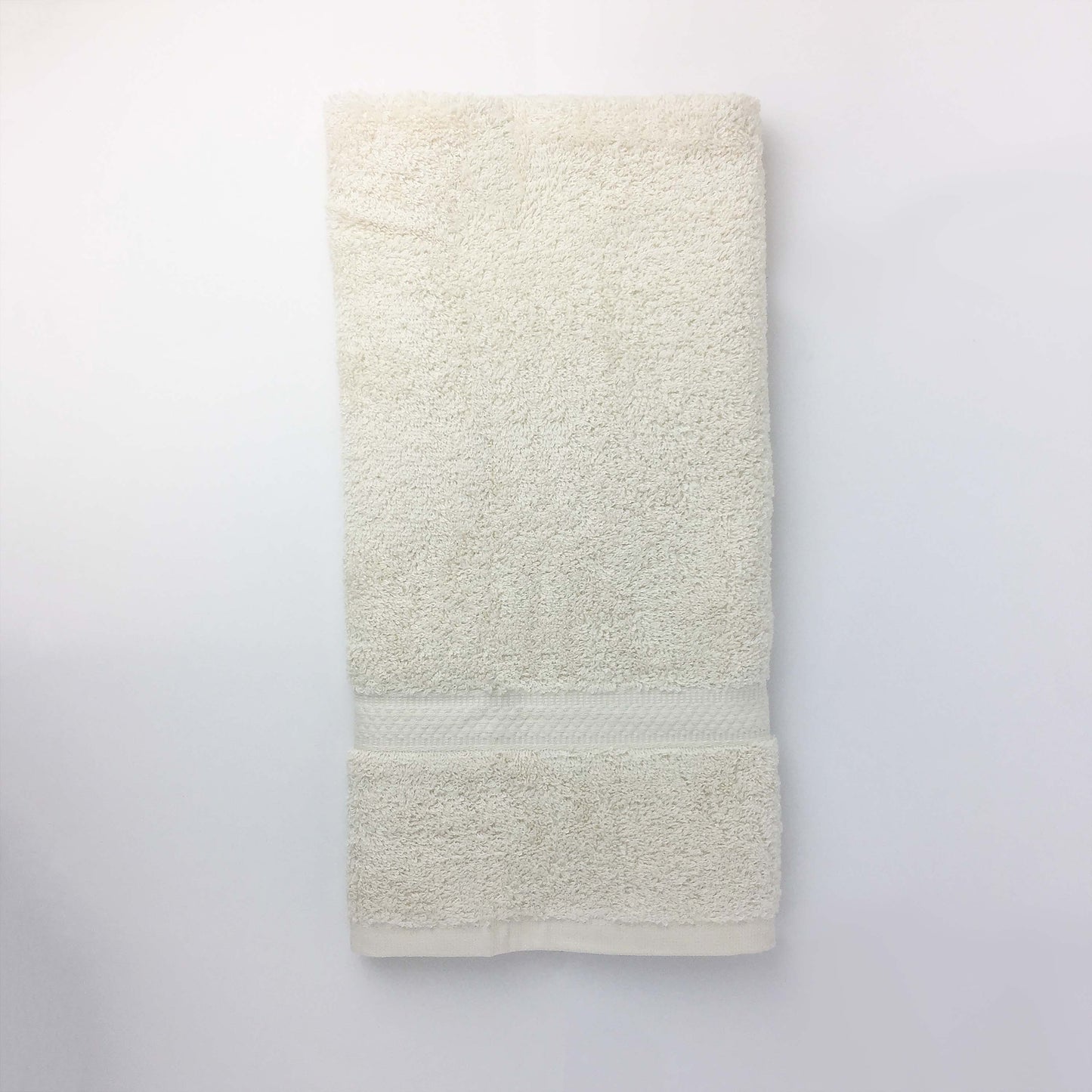 one ecru hand towel close up