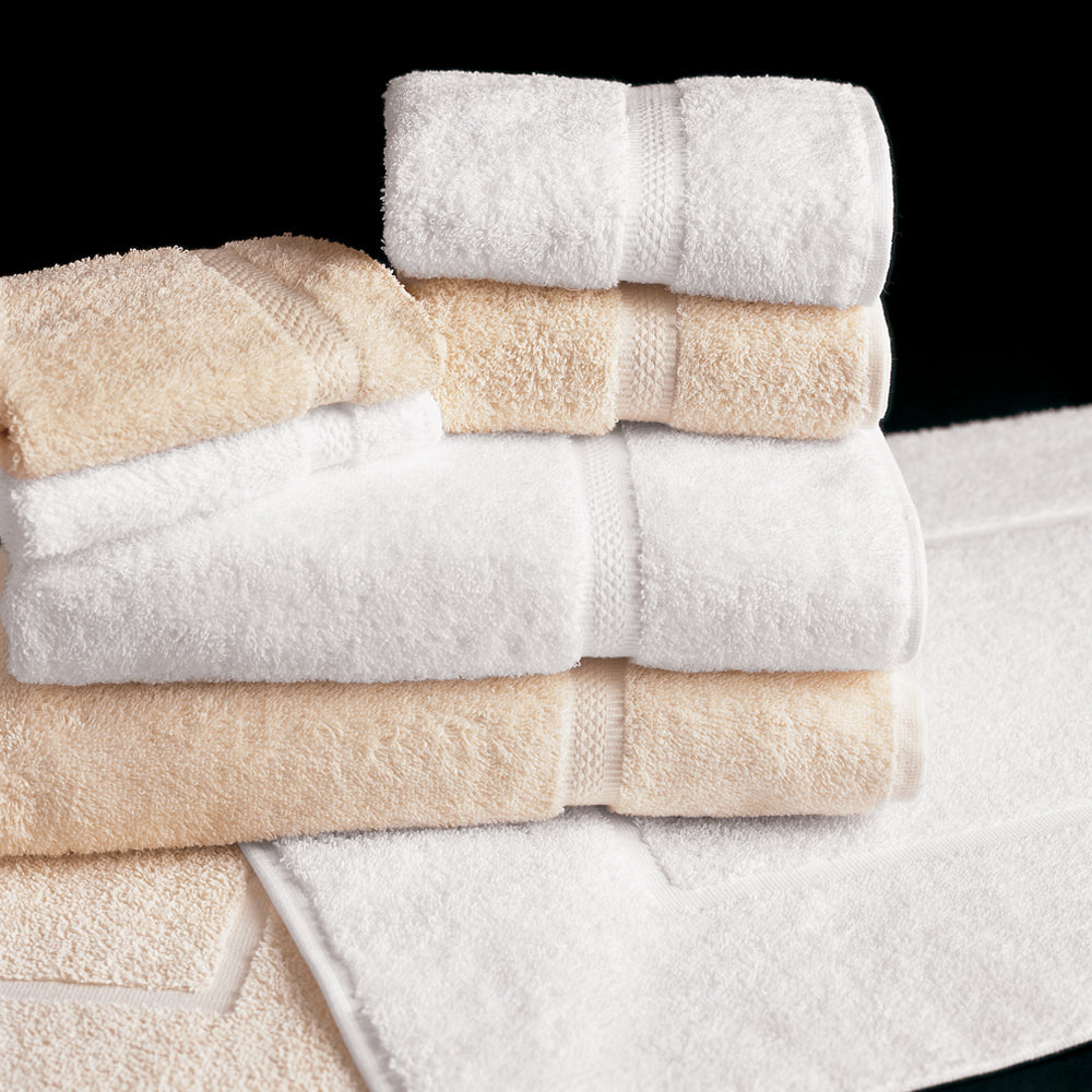stack of ecru and white towels, two small and one large for each color