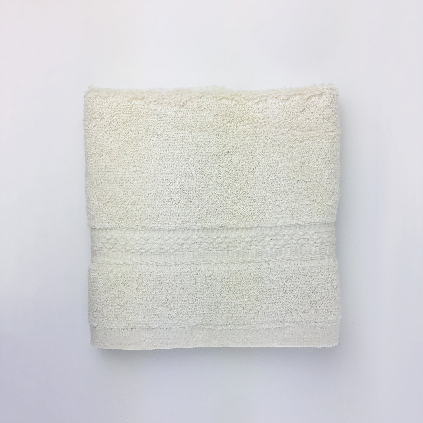 one ecru towel folded