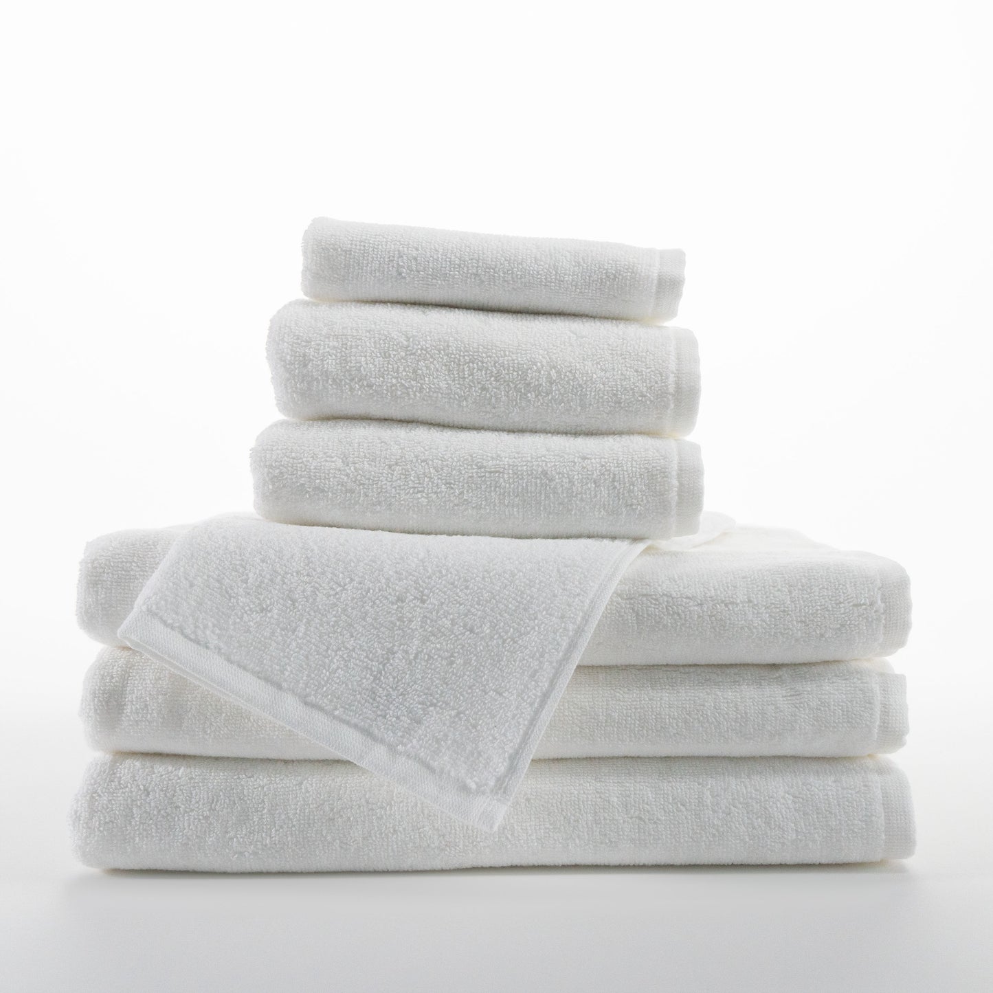 stack of white towels, three small three large