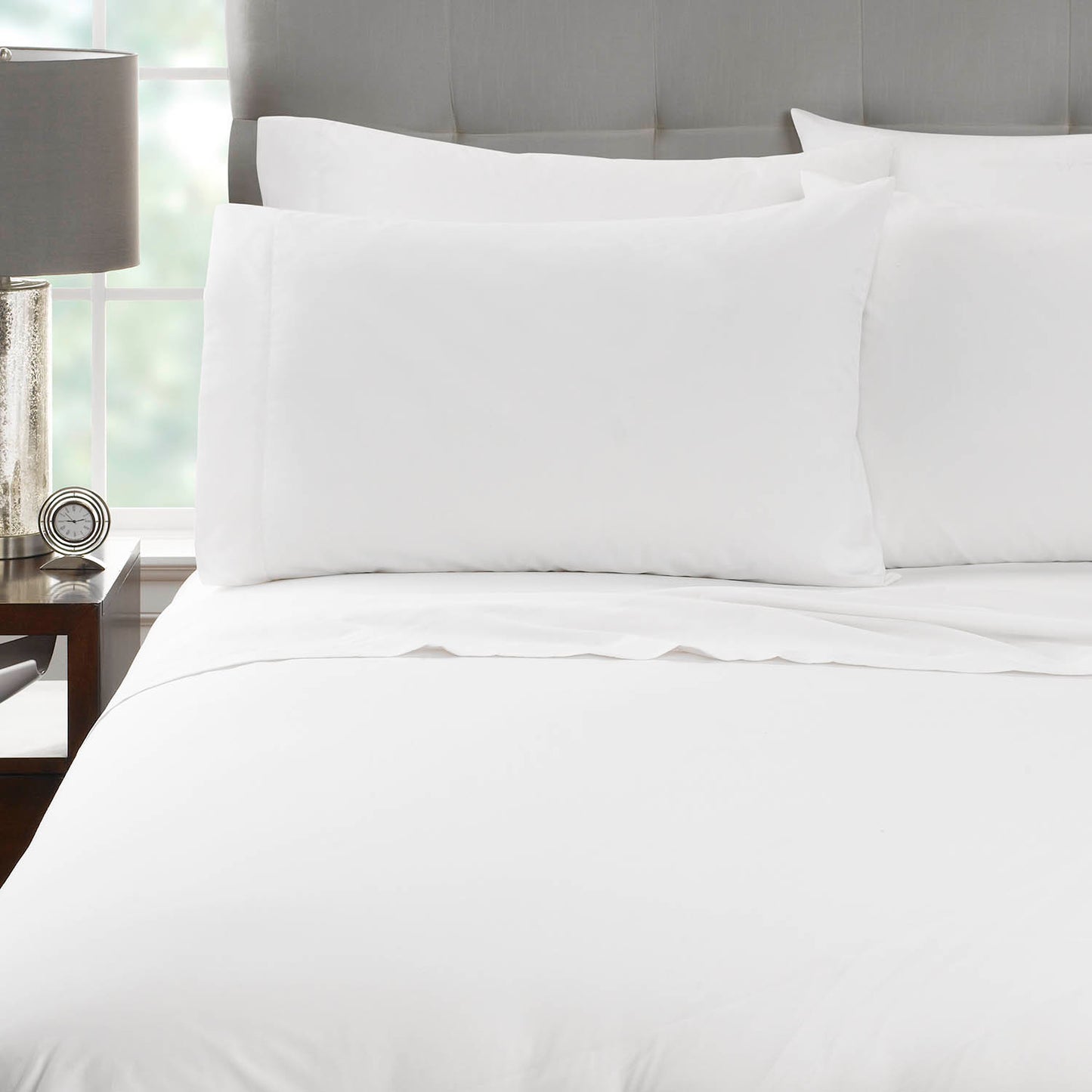 white sheets on bed