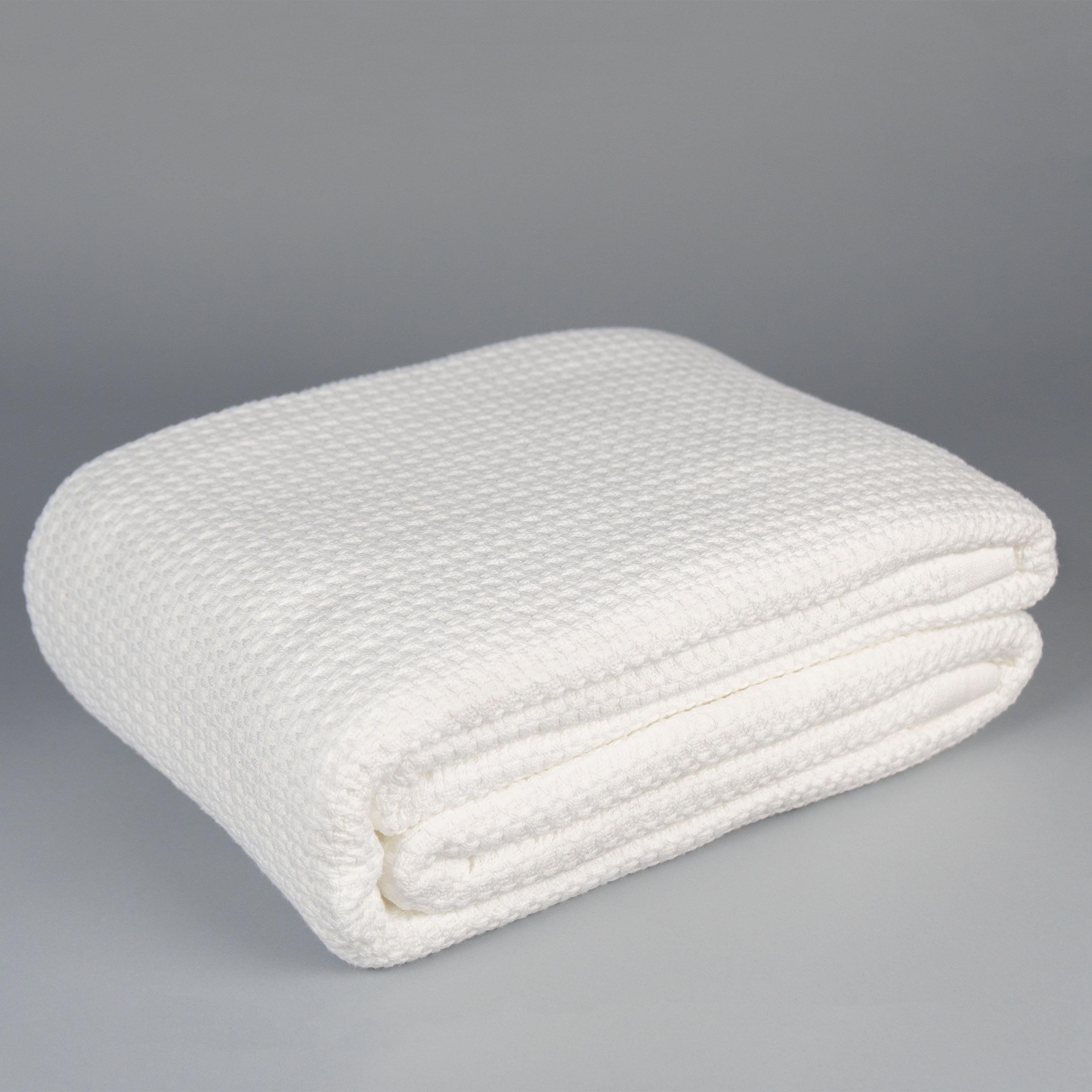 white basketweave cotton blanket