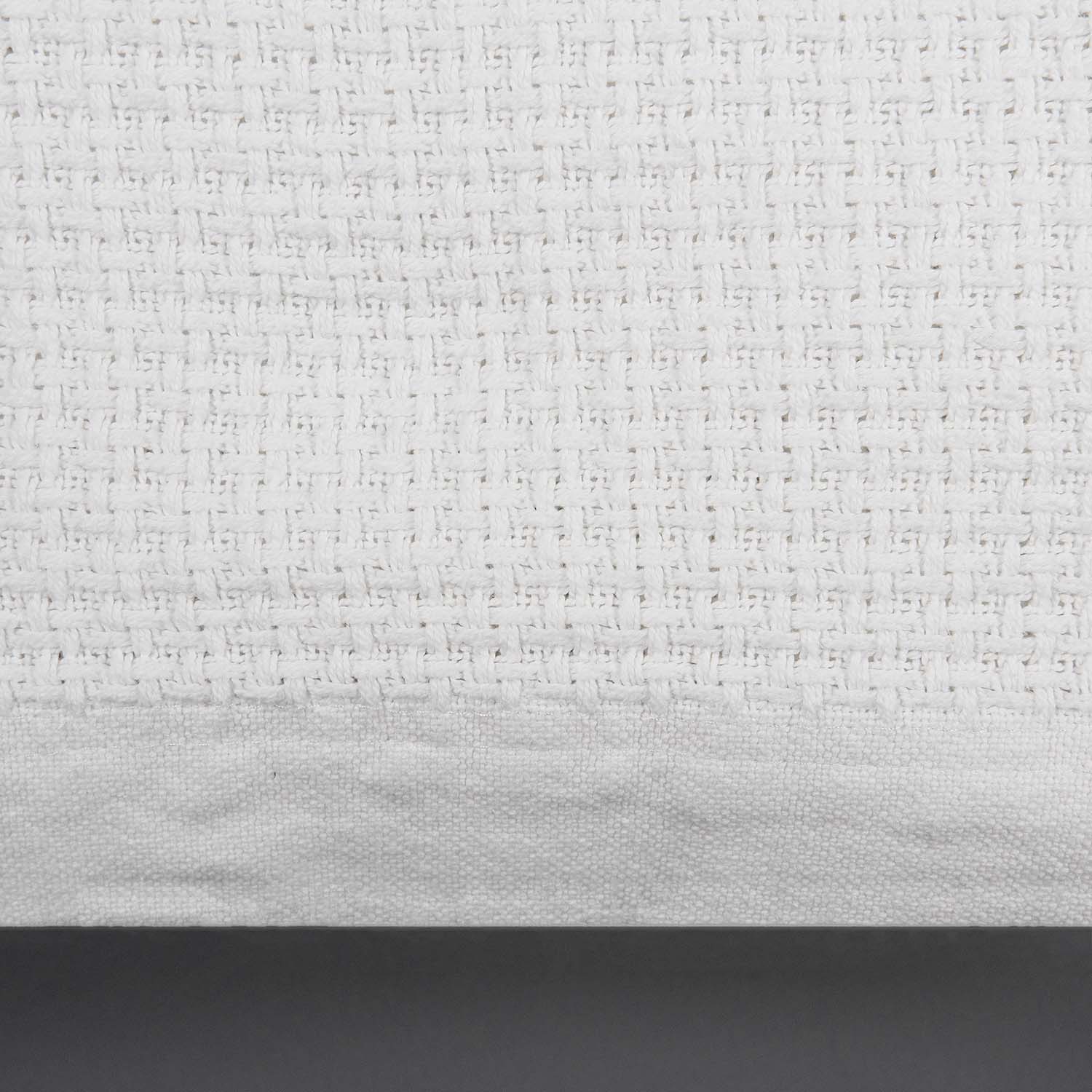 White basketweave cotton blanket. Close up showing 2" plain weave trim. 