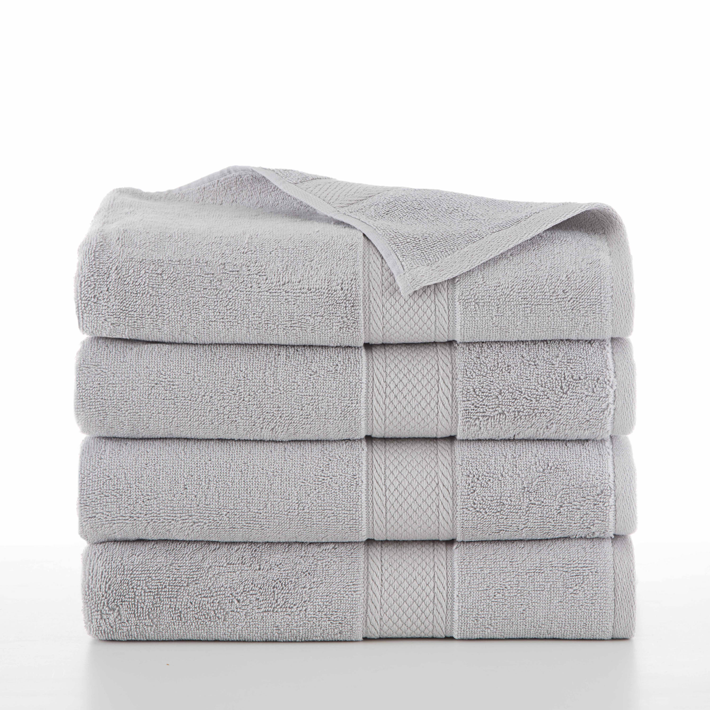 four grey towels folded in a stack