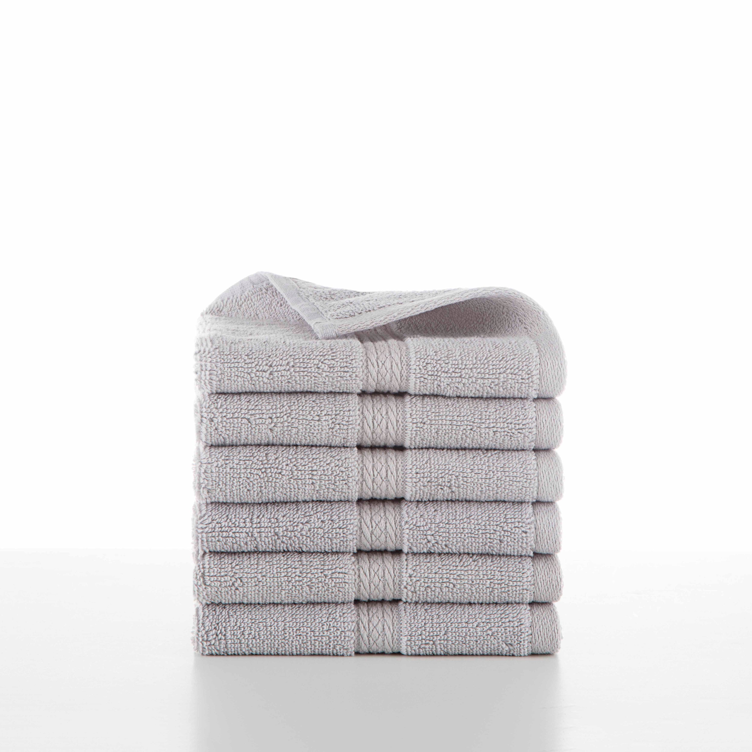 six grey towels in a stack