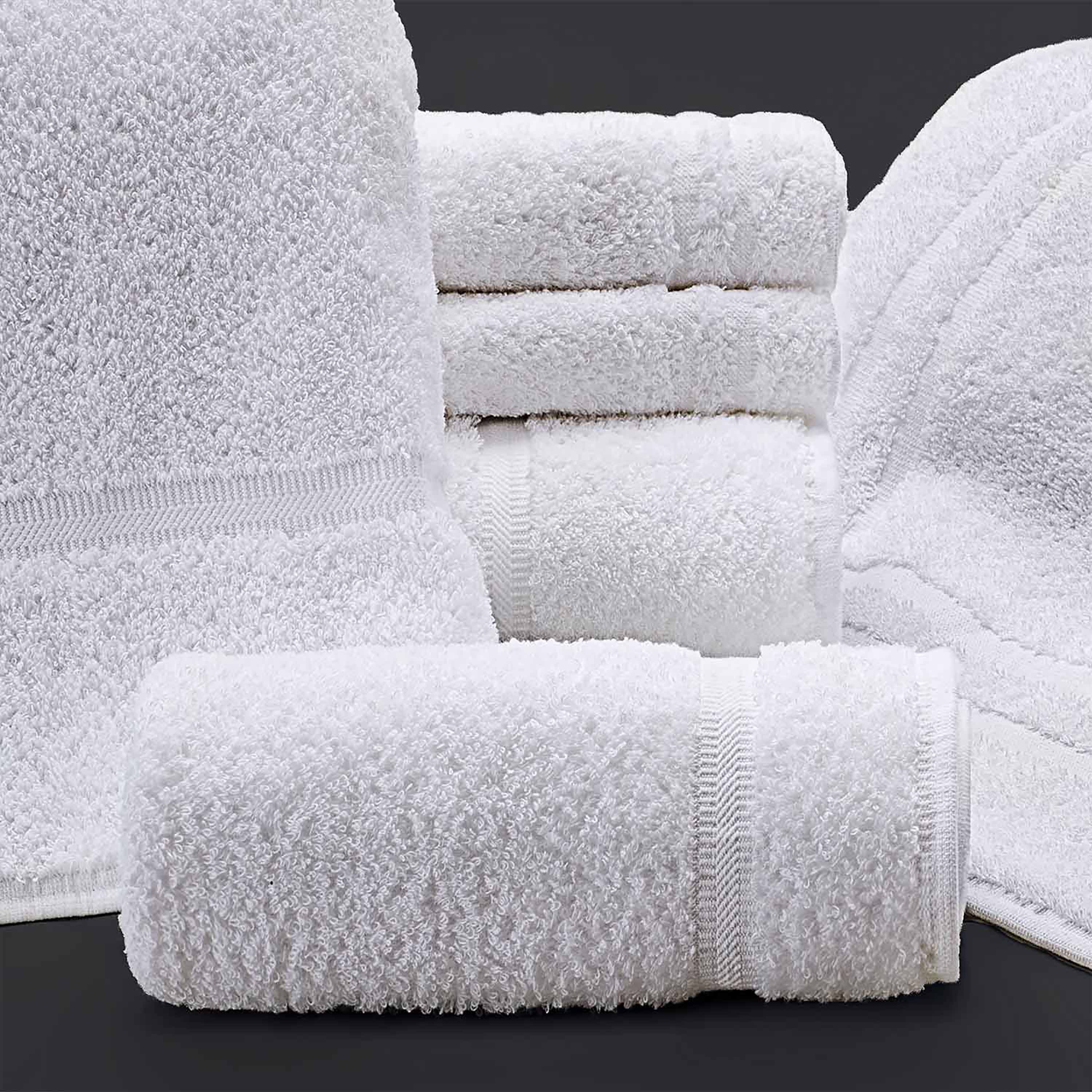 stacks of white towels and in a roll
