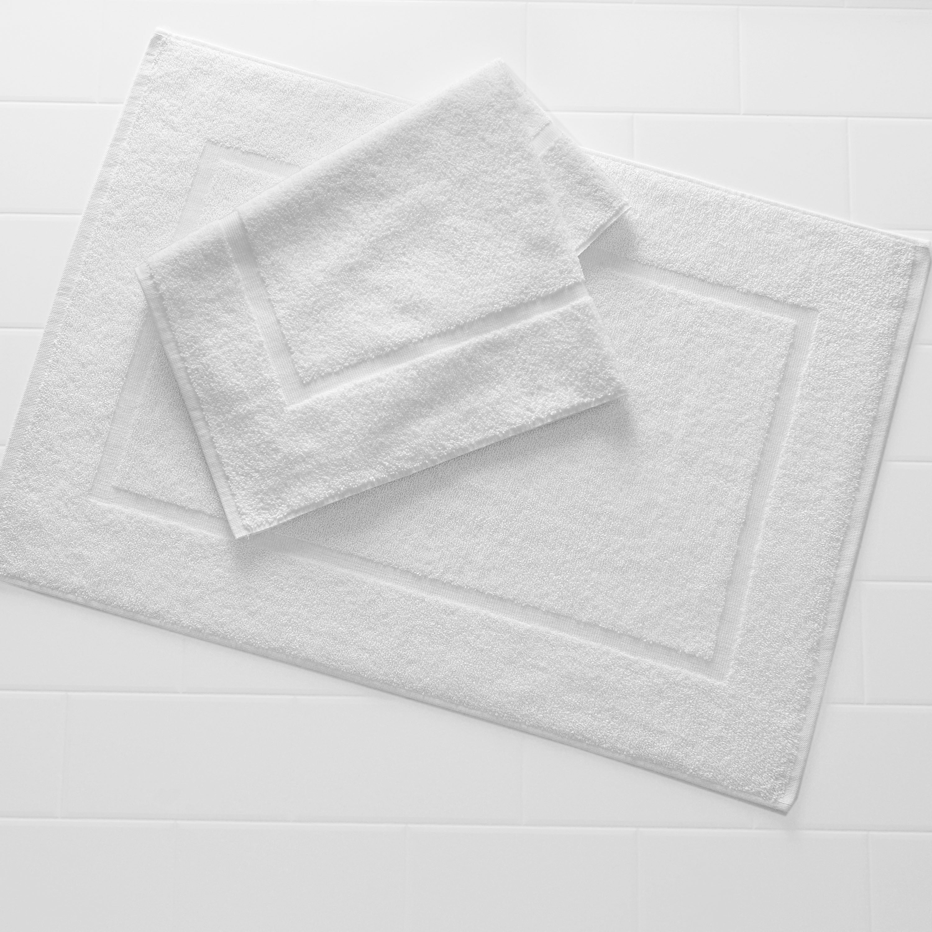 two white bath mats
