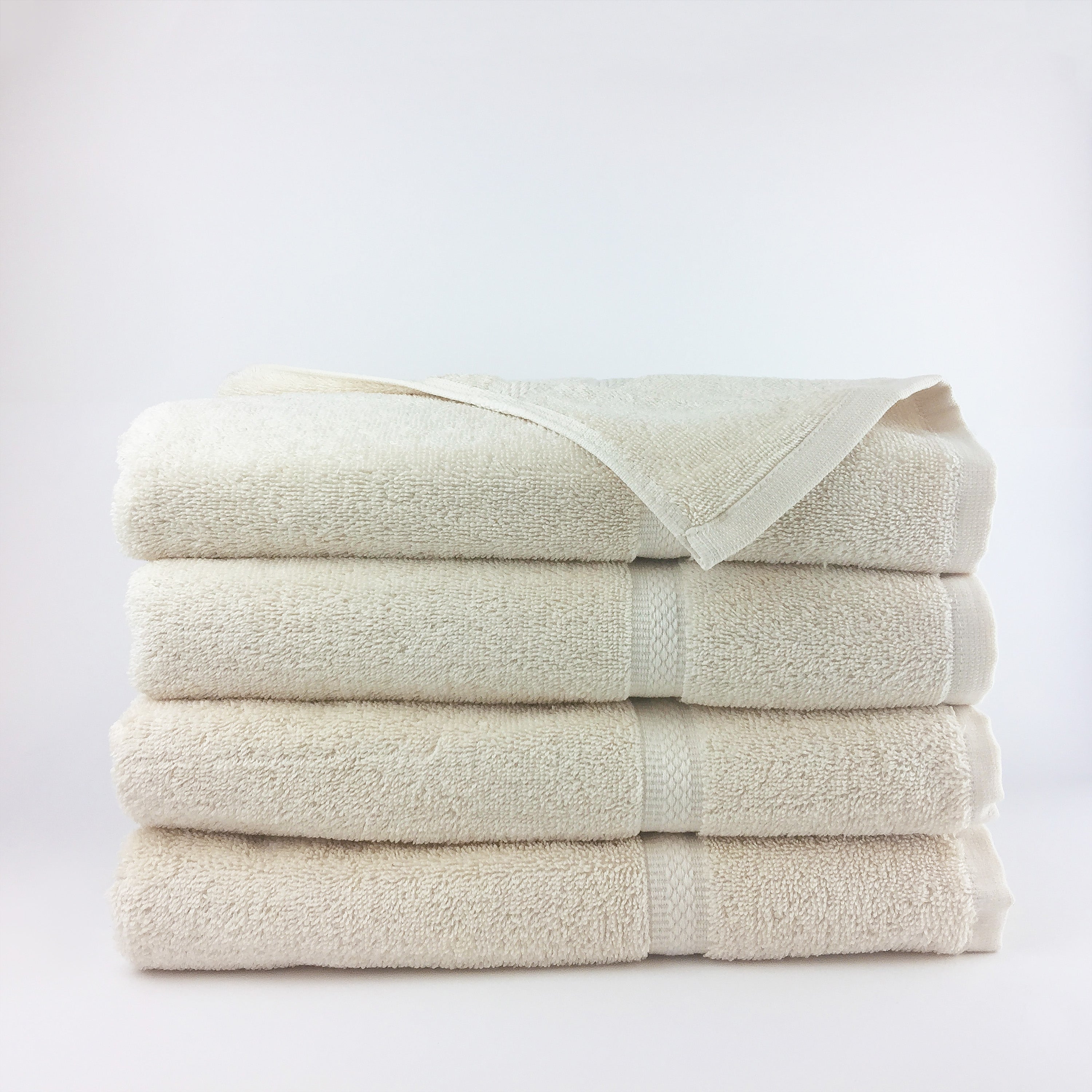 four ecru towels in a stack