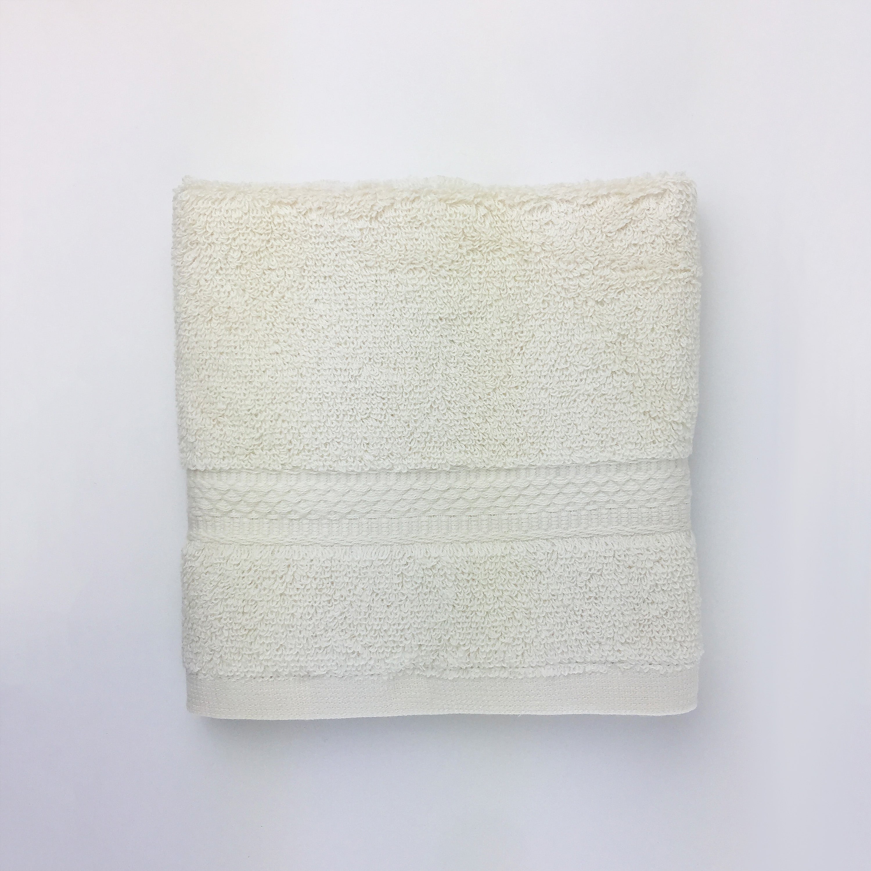 one ecru towel folded