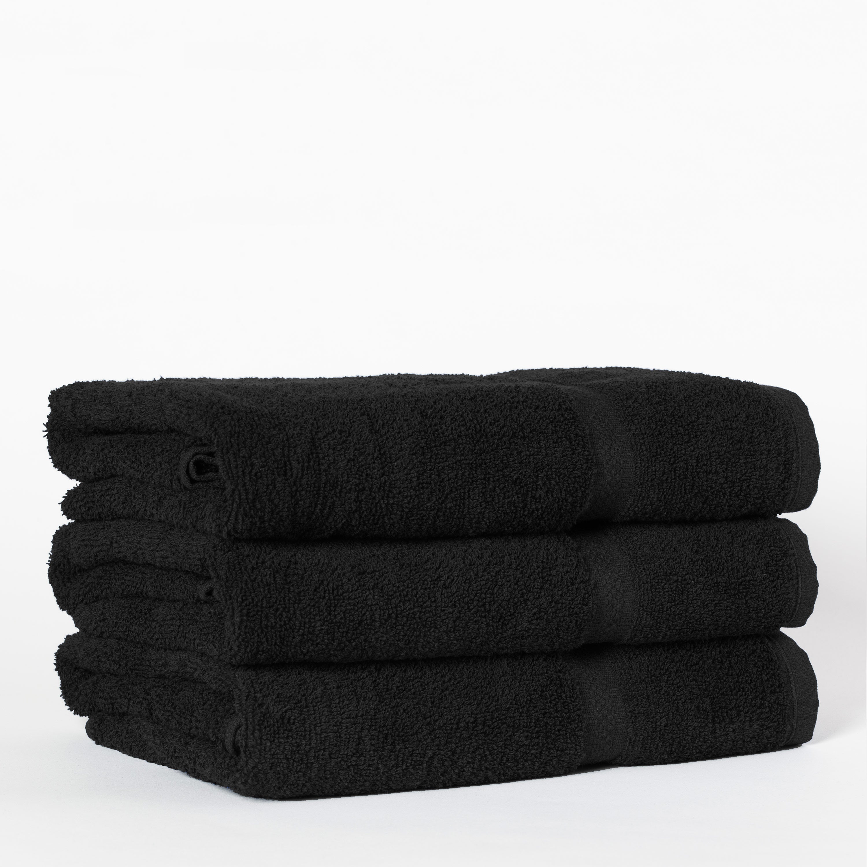 stack of three black towels