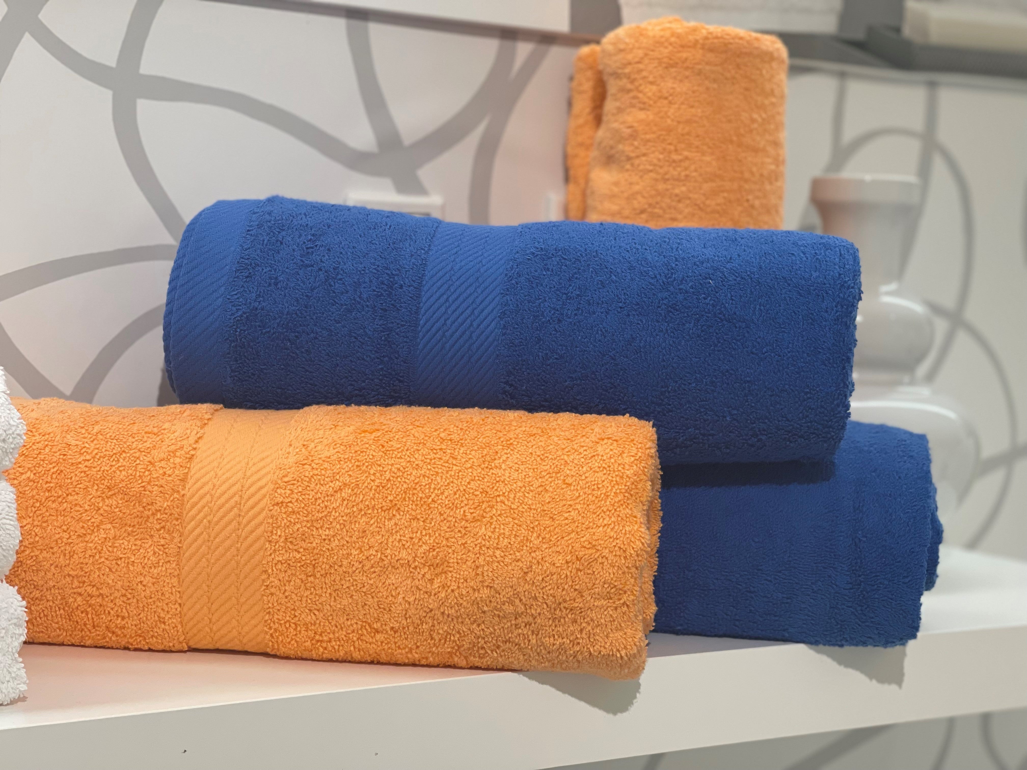 two rolls each of royal blue and persimmon towels