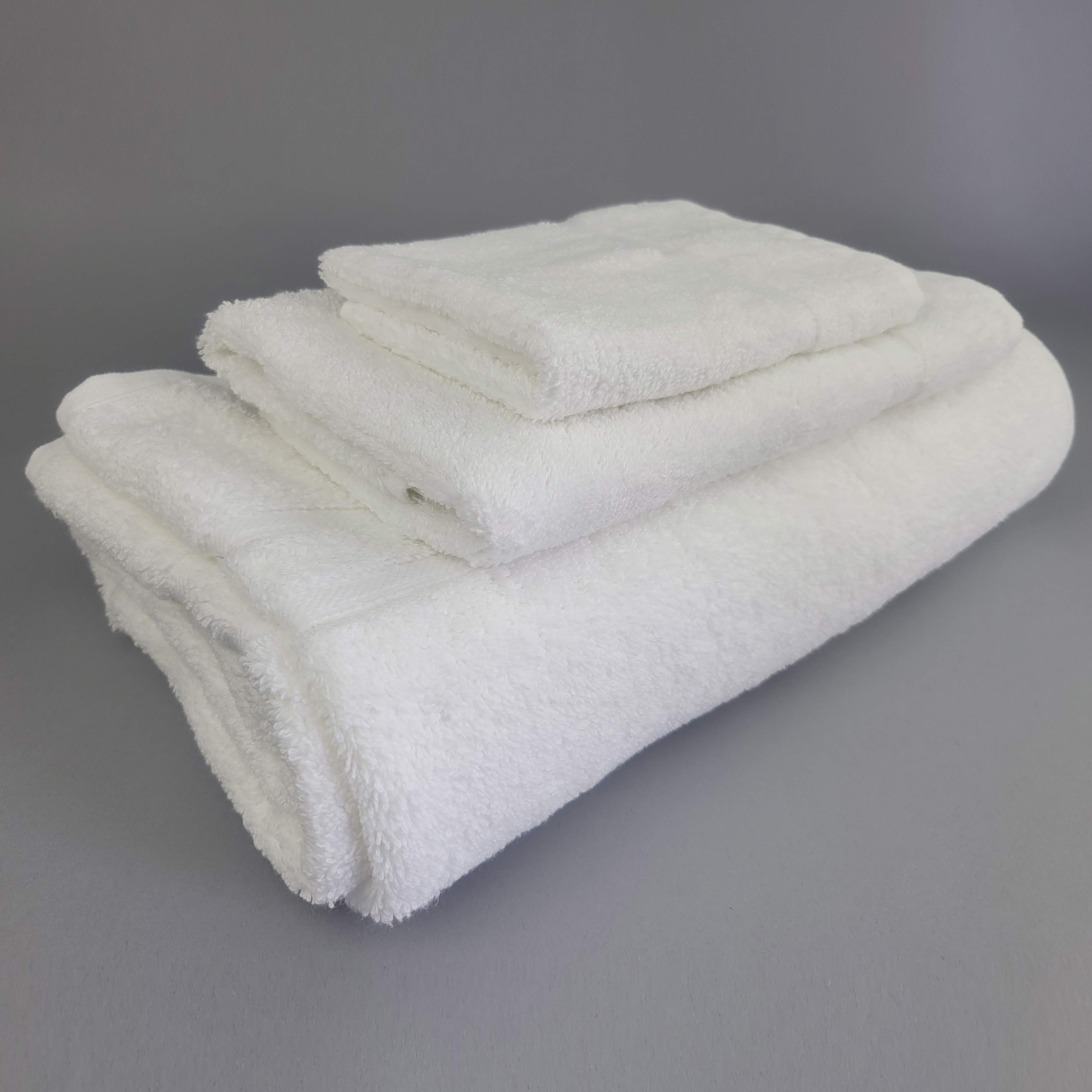stack of small medium large white towels
